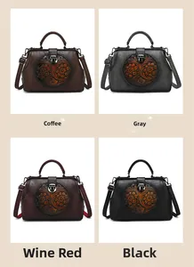 Detail view of four vintage embossed handbags in coffee, gray, wine red and black