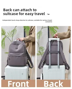 Nylon backpack detail showing the back strap securely attached to a suitcase handle