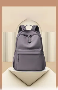 Close-up of waterproof nylon backpack featuring smooth zippers and a front pocket