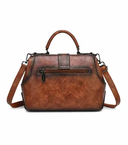 Rear view of vintage brown leather handbag showing back zipper pocket and strap
