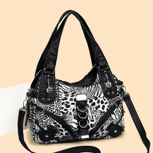 Chic animal print washed leather handbag with silver studs and adjustable shoulder strap