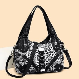 Leopard and zebra print washed leather shoulder bag with punk rivets and silver hardware
