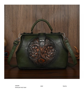 Detailed view of dark green retro handbag featuring 3D floral embossing and metal clasp