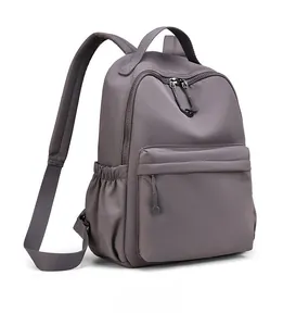 Side view of dark purple water-resistant nylon backpack with spacious zipper pockets