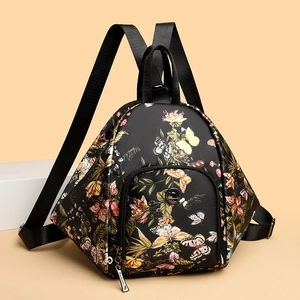 Floral print black nylon backpack with butterfly pattern and multiple zipper compartments