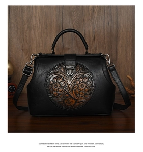 Macro detail of vintage black leather bag featuring floral embossed pattern and bronze clasp
