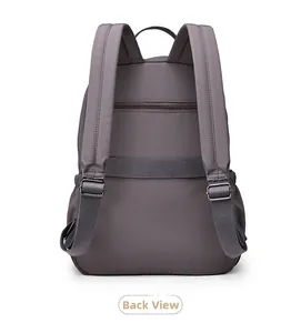 Back view of waterproof nylon backpack showing luggage strap and anti-theft zipper pocket