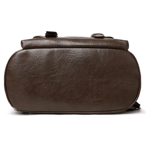 Brown faux leather backpack with litchi texture and wide base for travel