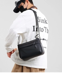 Waterproof black messenger bag shown on model for daily business and outdoor commute
