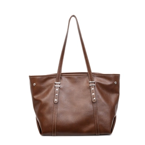 Retro brown leather tote bag with white stitching and silver rivets for daily use
