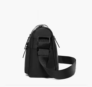 Detail view of the black waterproof messenger bag with adjustable shoulder strap and metal buckle