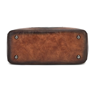 Vintage brown embossed leather handbag base with protective metal feet and stitching