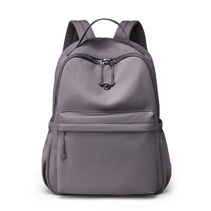 Minimalist lavender nylon backpack for women featuring waterproof fabric and large capacity
