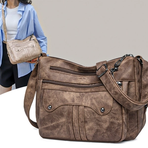 Vintage women's crossbody bag with multiple zip compartments and rivet details
