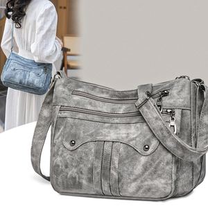 Vintage style multi-pocket crossbody bag with adjustable strap and rivet details