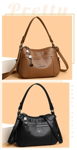 Detail view of large capacity litchi grain leather bags with multi-zipper compartments