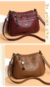 Detail view of multi-pocket soft leather handbags in burgundy and brown with gold hardware