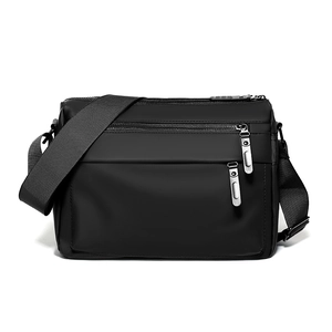 Waterproof black crossbody messenger bag with dual front zippers for outdoor commuting