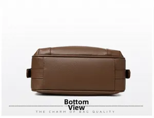 Detailed bottom view showing brown lychee grain leather and reinforced stitching on bag