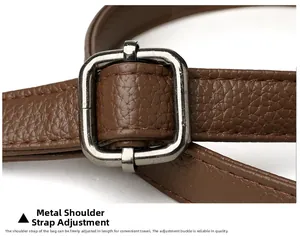 Detail of adjustable litchi texture leather shoulder strap with gunmetal buckle hardware