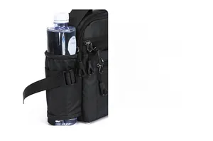 Detail view of the black crossbody bag featuring a side adjustable water bottle holder pocket