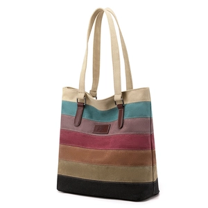 Multi-colored striped canvas tote bag with leather straps for women's daily commute