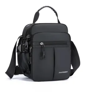 Close-up of waterproof Oxford fabric and ergonomic curved handle on black men bag