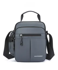 Front view of a grey multi-pocket oxford messenger bag with adjustable shoulder straps