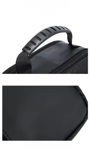 Detail of ergonomic anti-slip handle and white brand logo on black oxford fabric bag