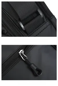 Detail view of durable D-ring buckle and smooth zipper system on black shoulder bag