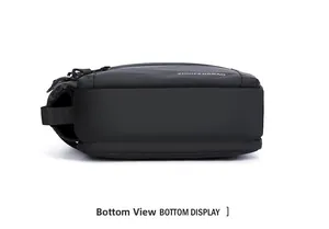 Detailed bottom view of black waterproof nylon crossbody bag showing durable reinforced base