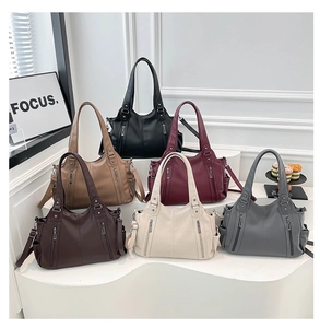 Close-up of stylish faux leather tote bags in six colors with pebble texture detail