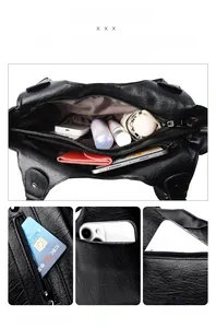 Macro view of multi-compartment interior and functional pockets of the black tote bag