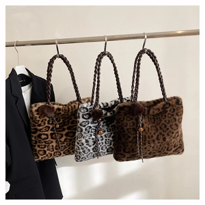 Three leopard print faux fur tote bags in brown and grey hanging with woven handles
