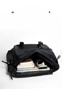 Internal view of waterproof messenger bag showing large capacity for tablet and gear