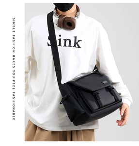 Black waterproof crossbody messenger bag shown on model for daily wear and size guide