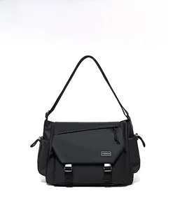 Front view of a black waterproof messenger bag with dual buckles and fashion label