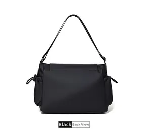 Back view of a black waterproof nylon messenger bag with functional side drawstrings