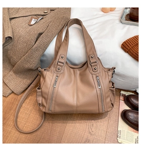 Chic light brown faux leather tote bag displayed with autumn fashion accessories