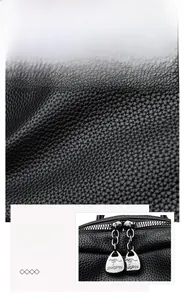 Detail of black lychee grain PU leather texture with high-quality dual metal zippers