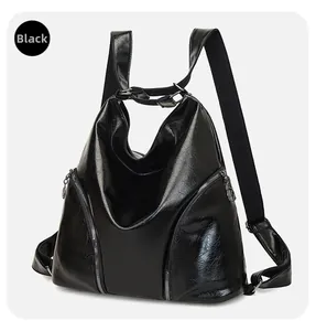 Detail of vintage black oil wax PU leather backpack with multiple zipper pockets