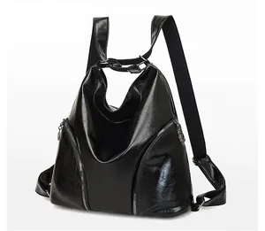 Side view of black glossy patent leather backpack showing smooth stereo structure