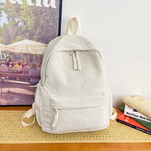 Minimalist beige corduroy backpack for women with multiple pockets in a college style