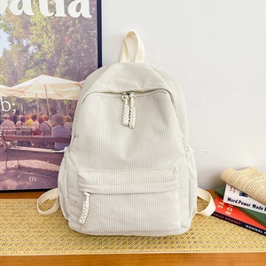 Minimalist beige corduroy backpack with ribbed texture and front zip pocket for women