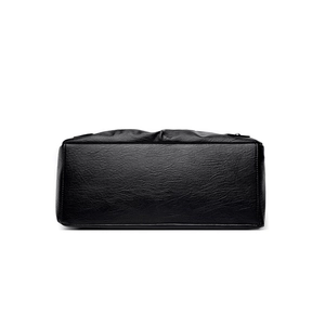 Retro black leather tote bag with pebble grain texture and spacious bottom view