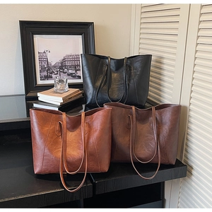 Three vintage PU leather tote bags in black, dark brown and caramel with long straps