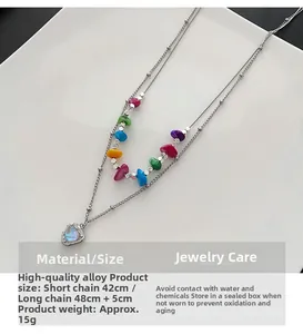 Détail du collier double cœur 42cm 48cm avec perles colorées et pendentif