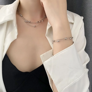 Minimalist silver multi-layer beaded necklace and bracelet set in stainless steel