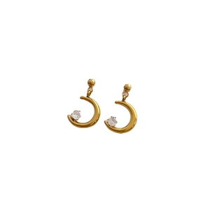 Elegant gold crescent moon earrings with cubic zirconia inlay on a white background