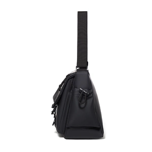 Waterproof matte black techwear messenger bag with adjustable side drawstring and nylon strap